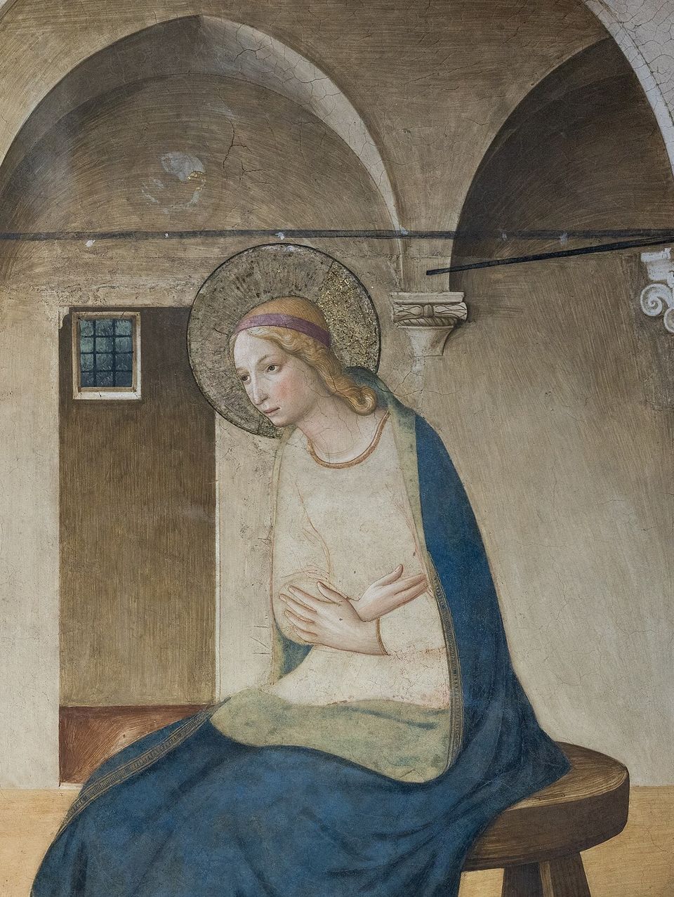 The Virgin Mary seated in a loggia, arms crossed over her breast, receiving the angel’s greeting. Detail of Fra Angelico’s Annunciation.